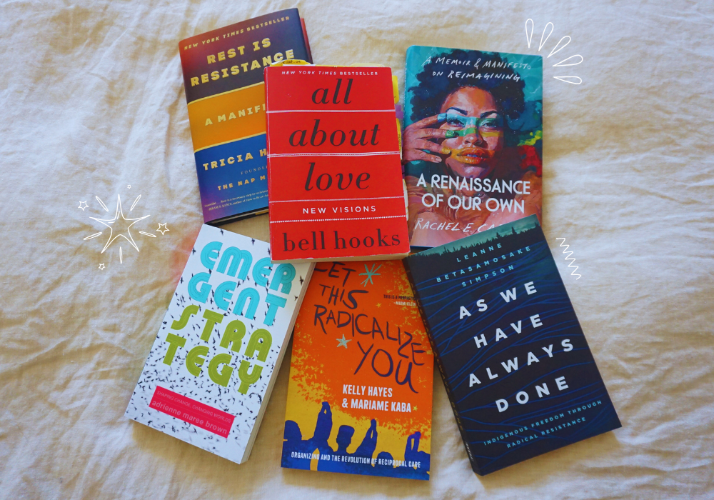 6 books laid out on a beige bedspread